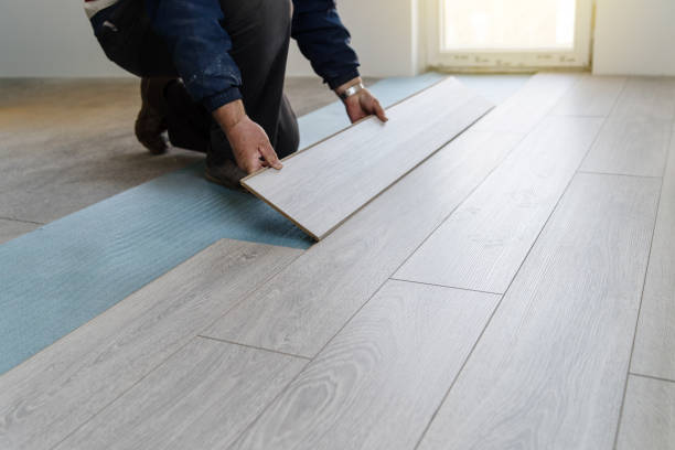 Light laminate flooring installation in Washington family room